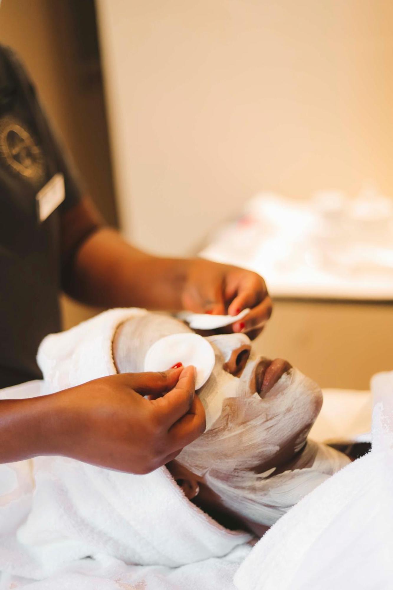 Radisson Blu Hotel & Convention Centre Kigali Exterior photo A woman applying a facial mask
