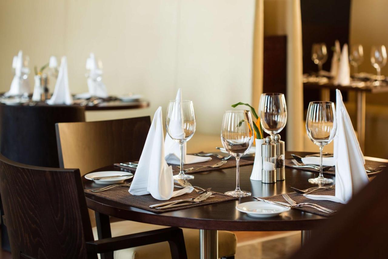 Radisson Blu Hotel & Convention Centre Kigali Exterior photo A table set for fine dining
